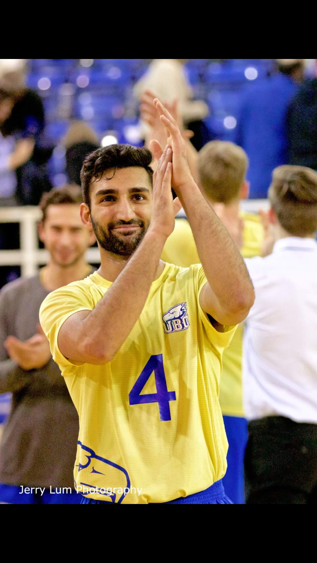 Irvan Brar in a UBC Thunderbirds jersey celebrating on the court